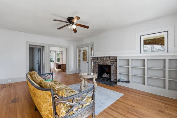 a living room with furniture and a fireplace
