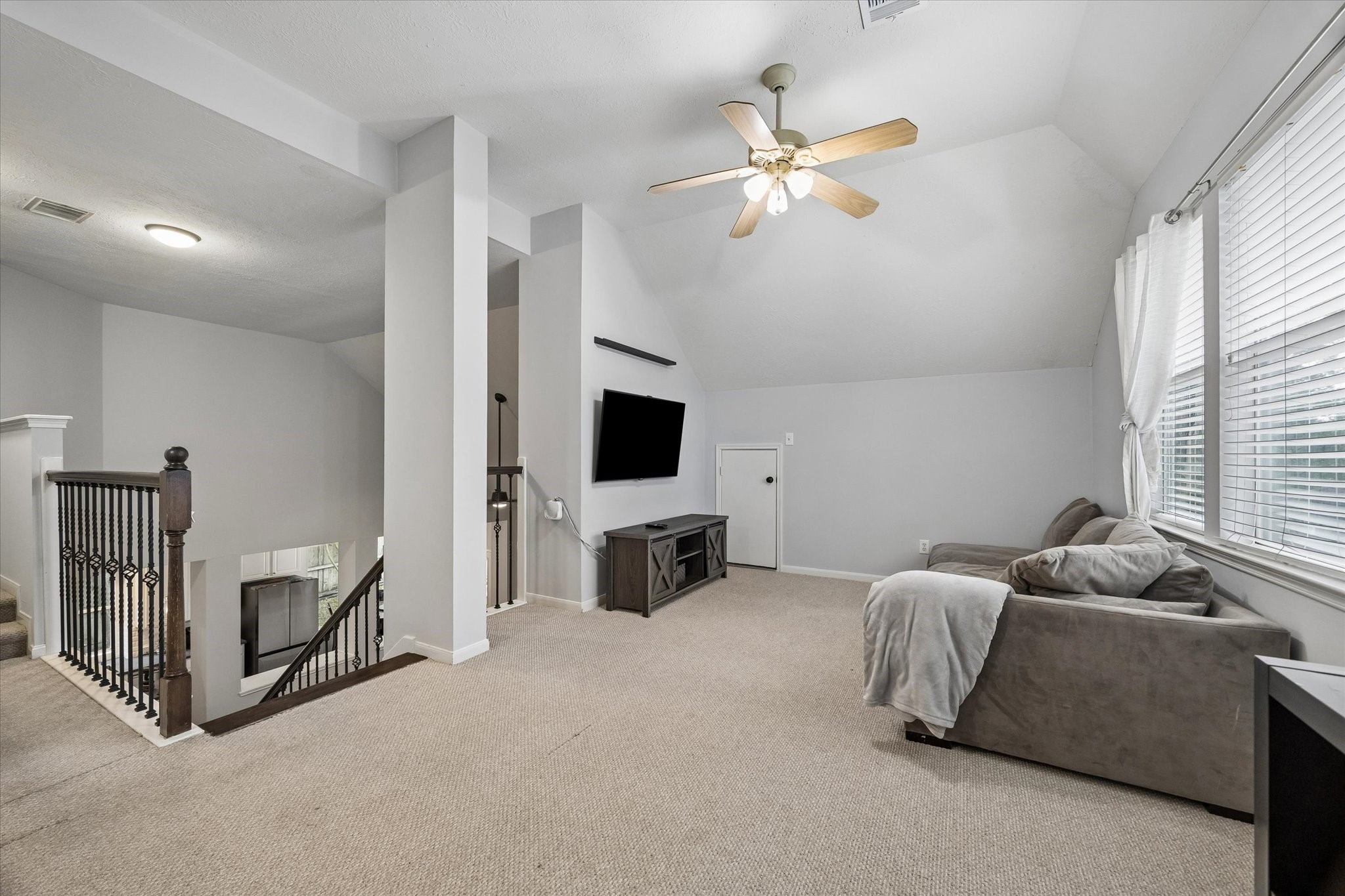 8123 Clarion Way Houston, TX 77040 - Photo 25 of 33 a living room with furniture and a flat screen tv