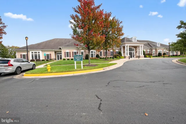 a view of residential houses with cars parked infront