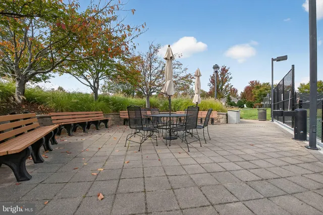 a view of a street with a building in the background