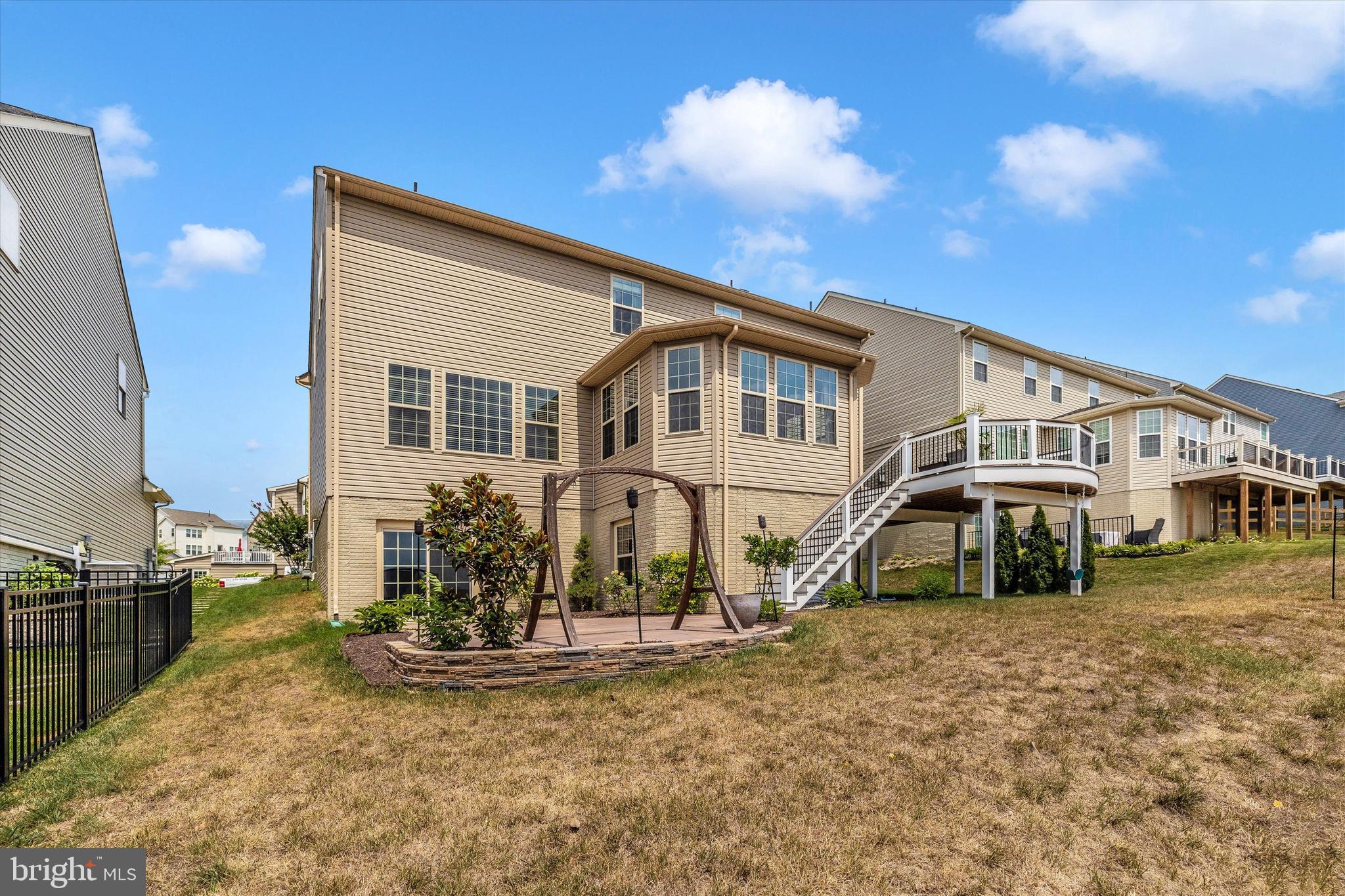 8405 Eagles Nest Road Frederick, MD 21704 - Photo 35 of 43 Backyard with Deck and Stone Patio
