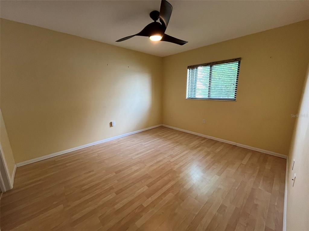25225 Rampart Boulevard, Unit 2107 Punta Gorda, FL 33983 - Photo 4 of 10 a view of empty room with wooden floor
