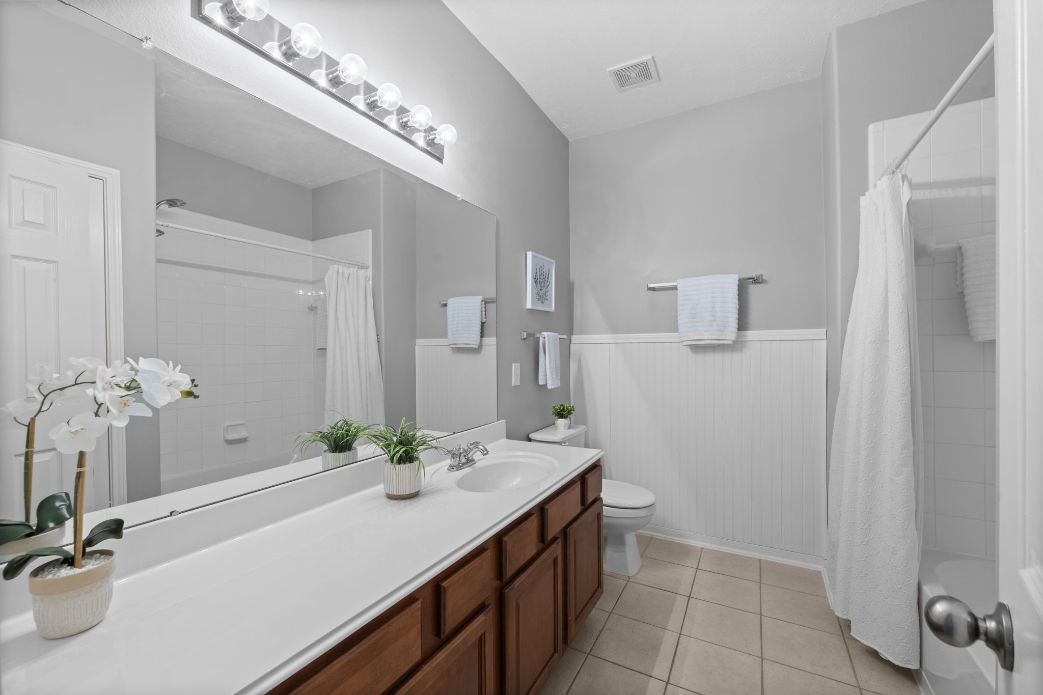 8407 Oak Villa Court Spring, TX 77389 - Photo 11 of 40 a bathroom with a double vanity sink and a mirror