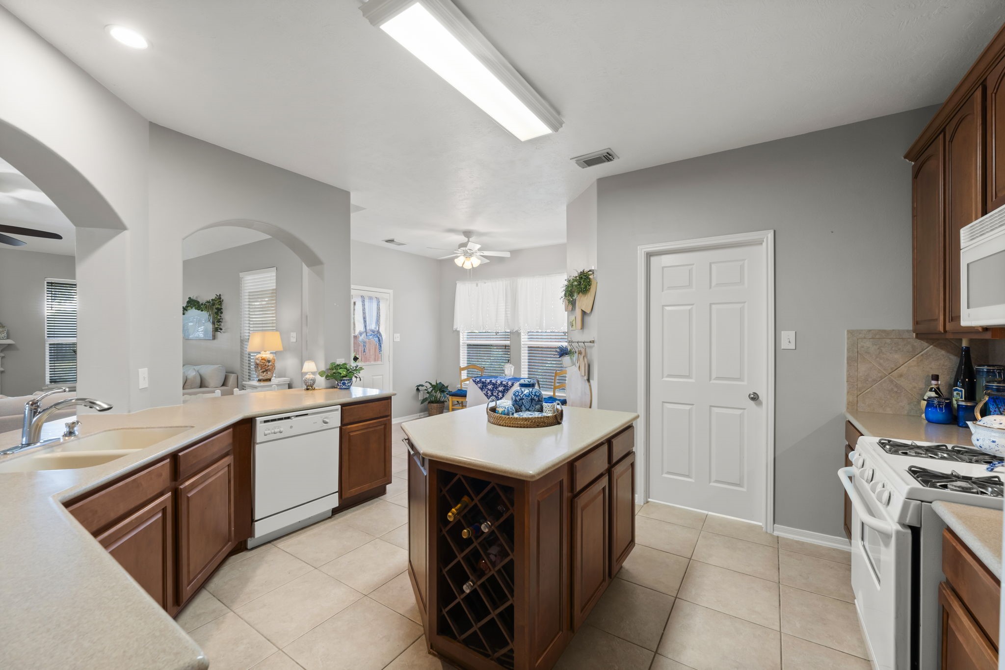 8407 Oak Villa Court Spring, TX 77389 - Photo 14 of 40 a kitchen with a sink stove and cabinets