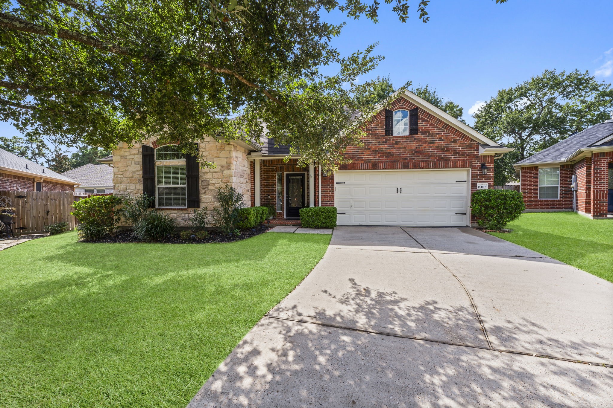8407 Oak Villa Court Spring, TX 77389 - Photo 2 of 40 a front view of house with yard and green space