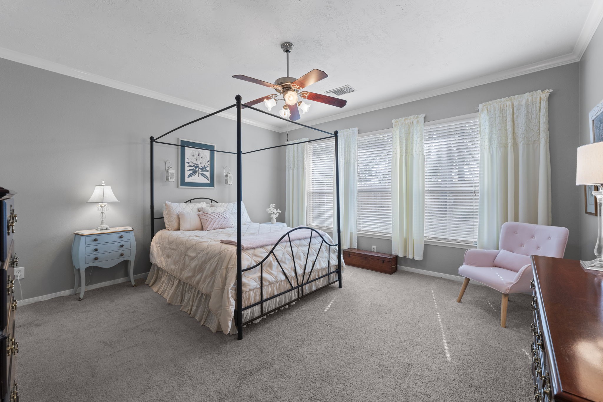 8407 Oak Villa Court Spring, TX 77389 - Photo 23 of 40 a spacious bedroom with a bed and a chandelier