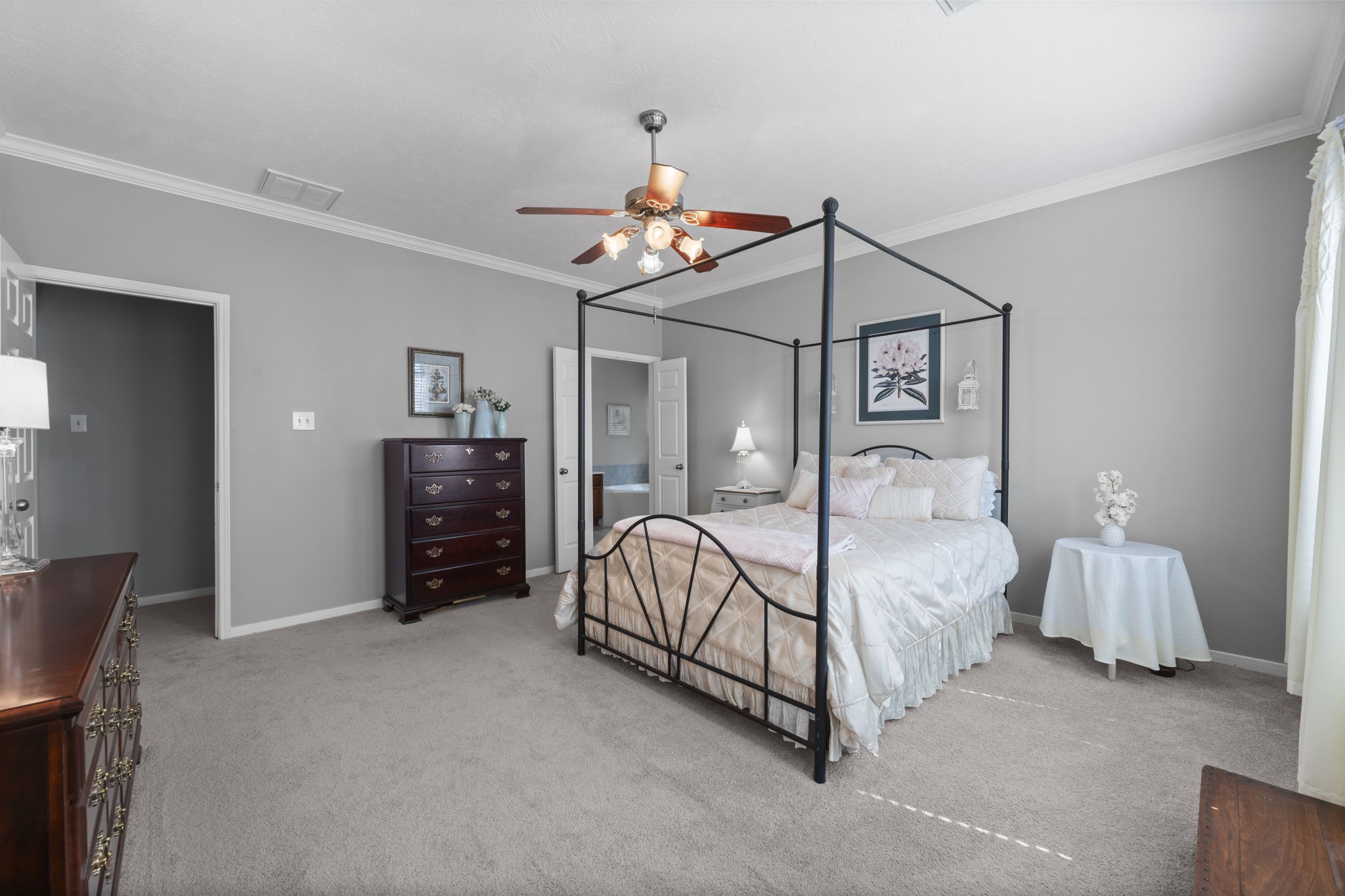 8407 Oak Villa Court Spring, TX 77389 - Photo 25 of 40 a bedroom with bed and a chandelier