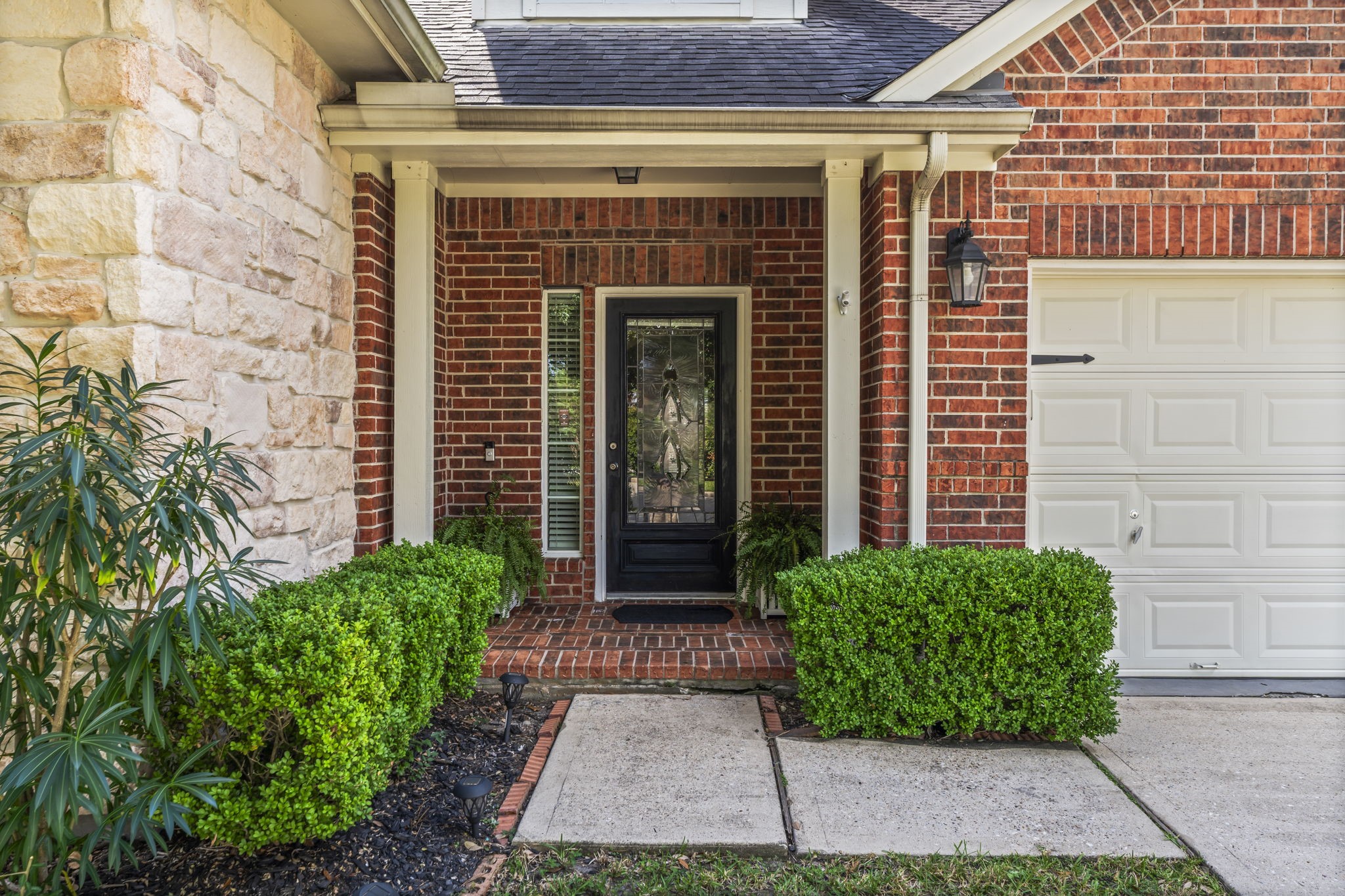 8407 Oak Villa Court Spring, TX 77389 - Photo 3 of 40 a front view of a house with garden