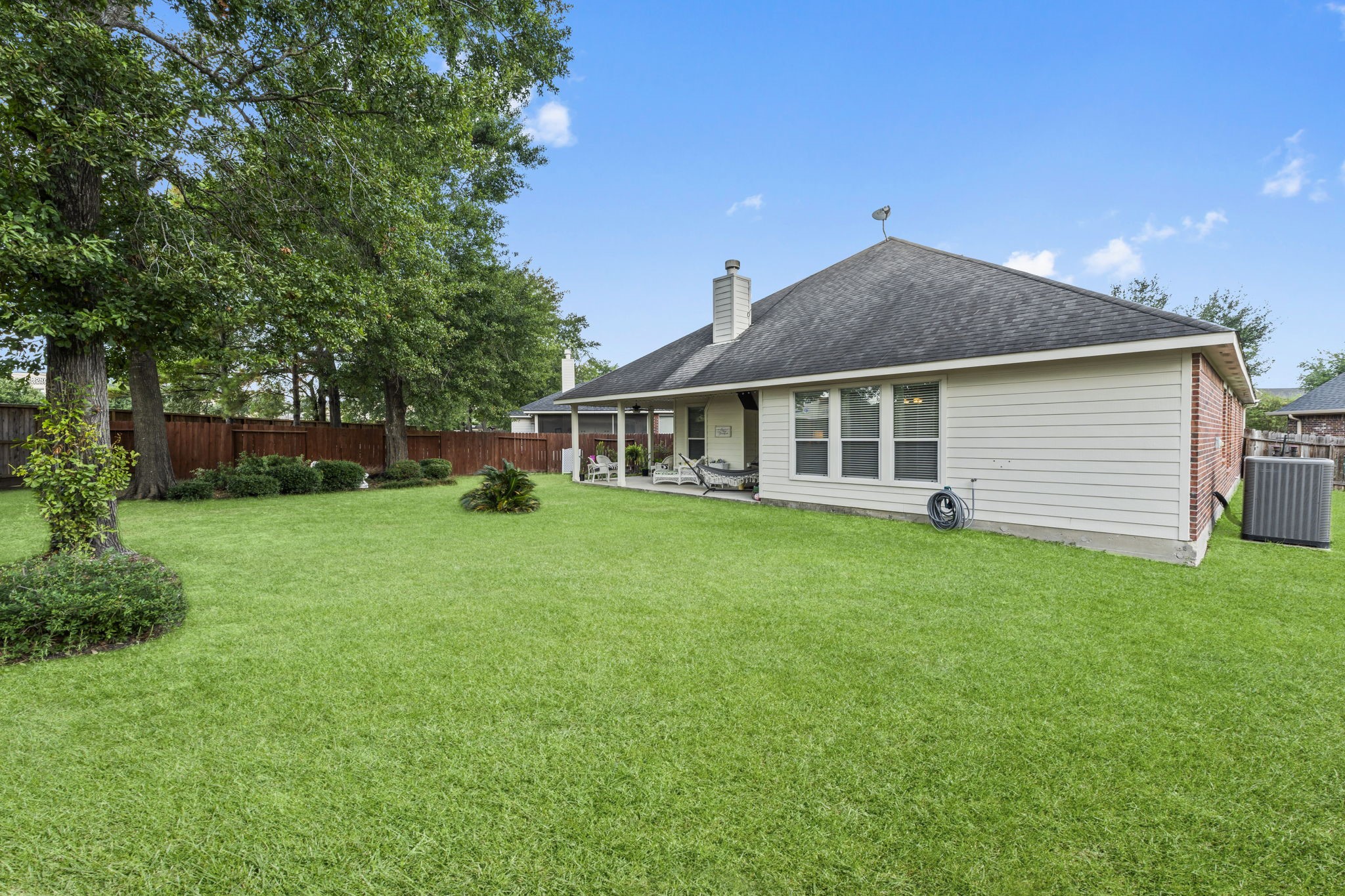 8407 Oak Villa Court Spring, TX 77389 - Photo 31 of 40 a front view of a house with a garden