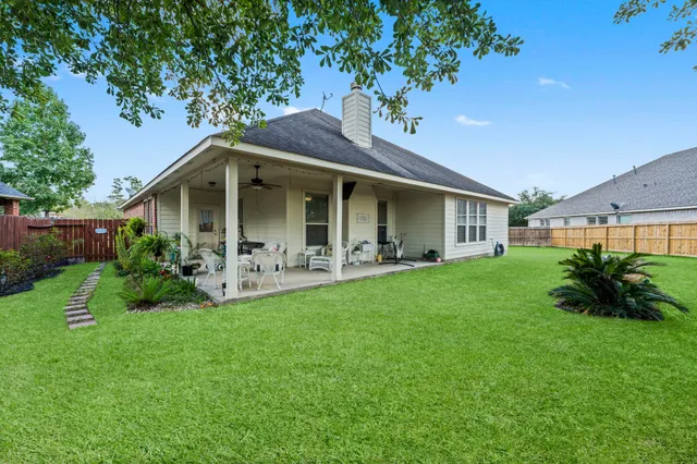 a front view of a house with a garden and porch