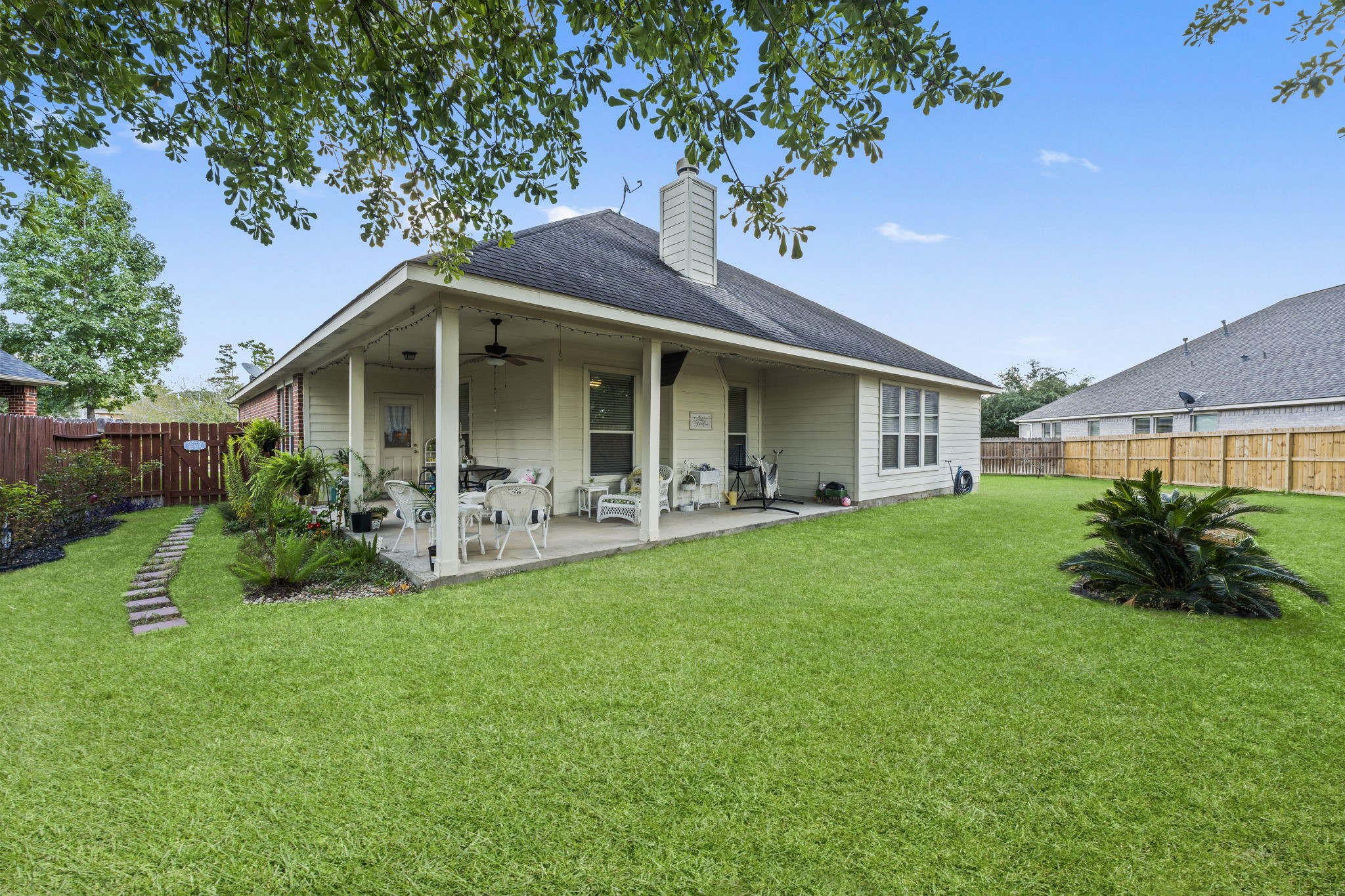 8407 Oak Villa Court Spring, TX 77389 - Photo 32 of 40 a front view of a house with a garden and porch