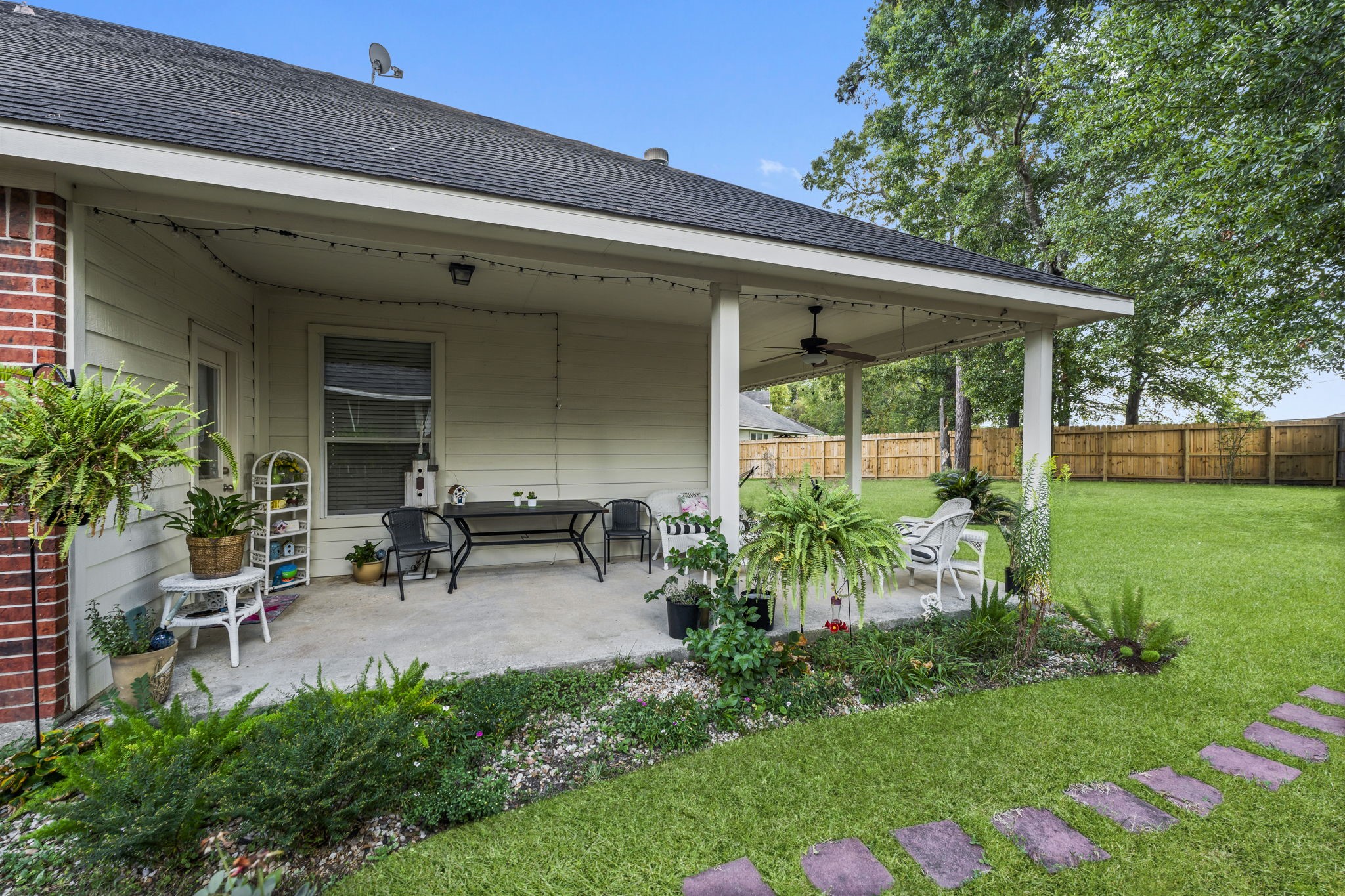 8407 Oak Villa Court Spring, TX 77389 - Photo 33 of 40 a view of a chair and table in backyard of the house