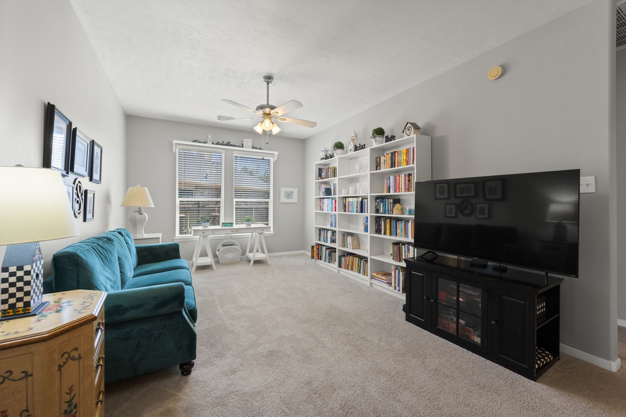 8407 Oak Villa Court Spring, TX 77389 - Photo 5 of 40 a living room with furniture and a flat screen tv