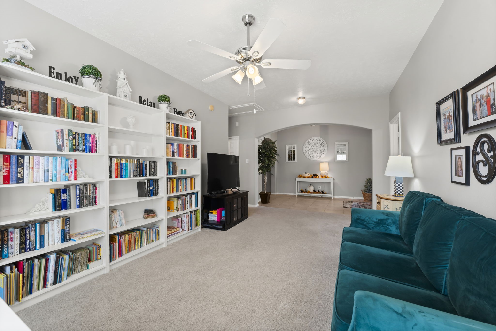 8407 Oak Villa Court Spring, TX 77389 - Photo 7 of 40 a living room with lots of furniture and a book shelf