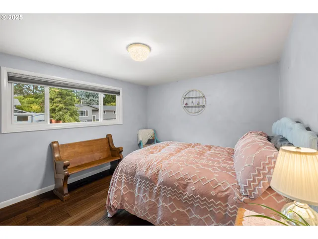 a bedroom with a bed and a chair