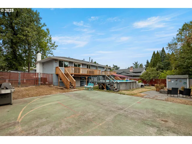 a view of a house with swimming pool and sitting area