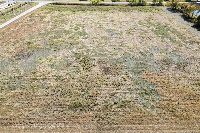 a view of a backyard of the house