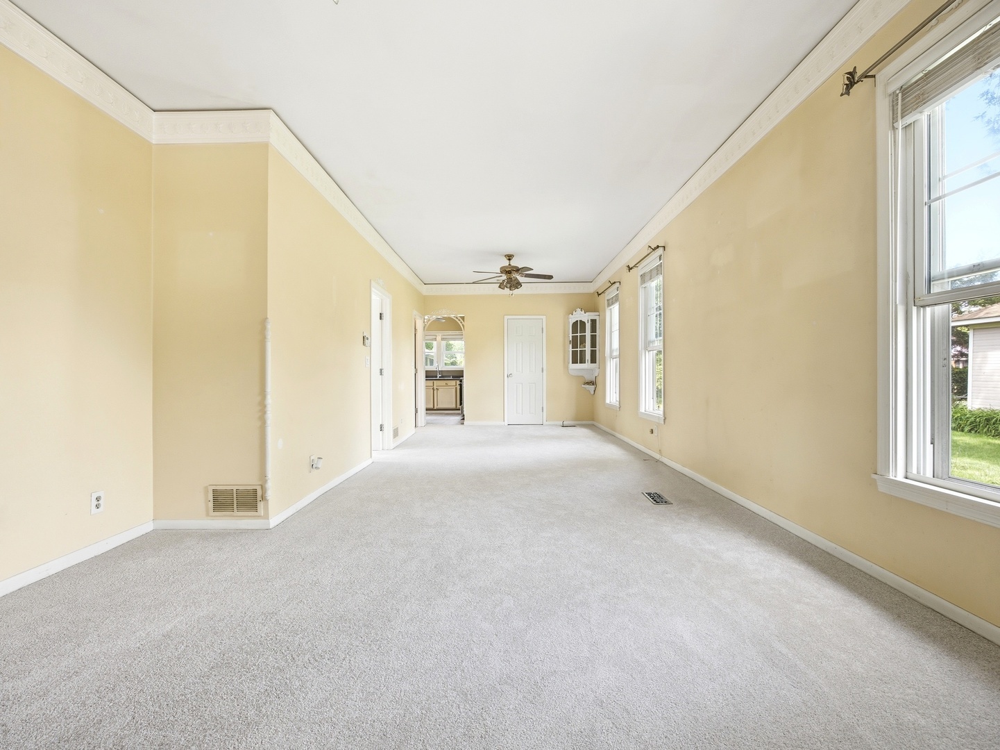 570 Addison Street Elgin, IL 60120 - Photo 6 of 17 a view of empty room with windows