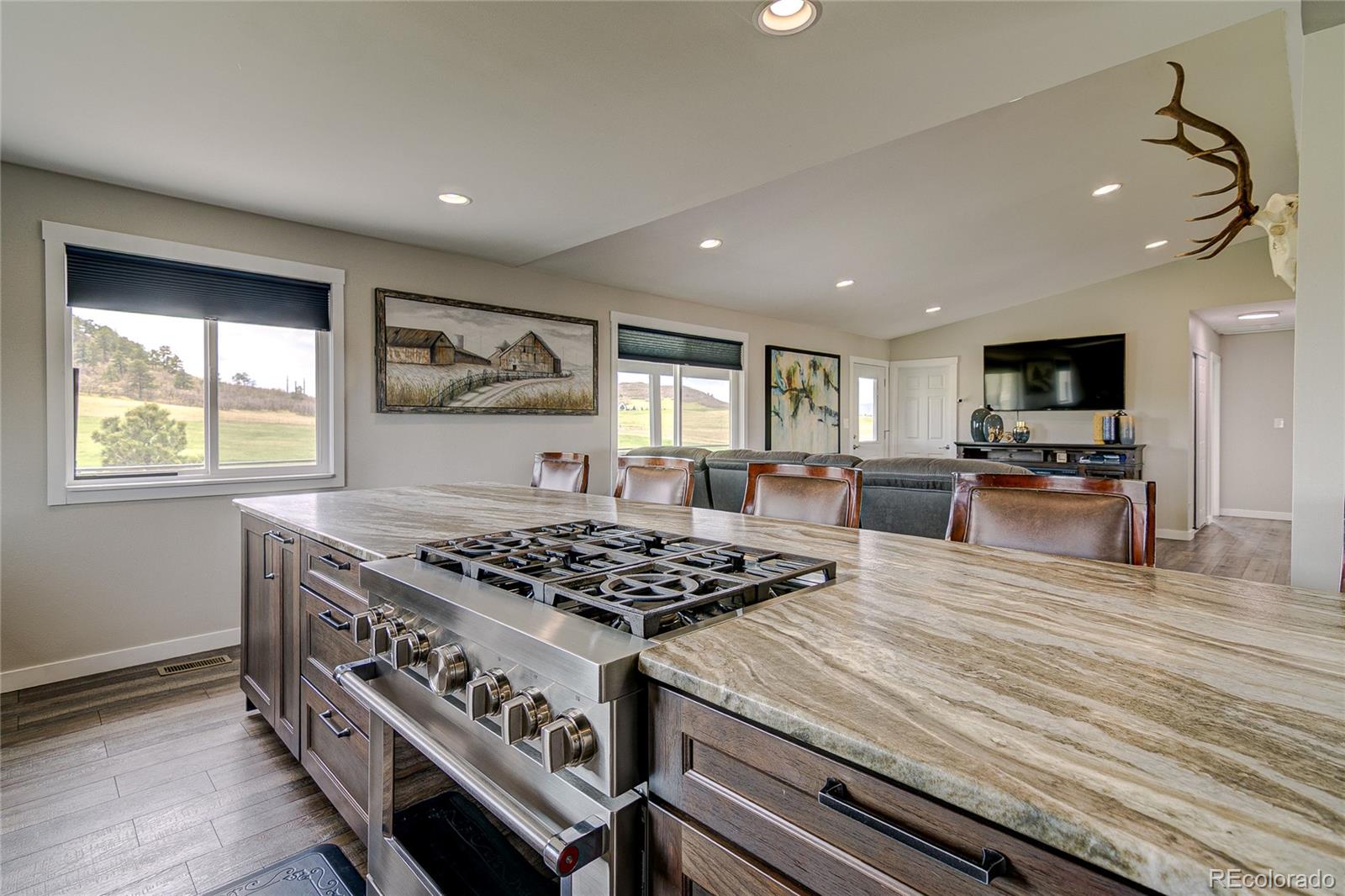 4531 East Best Road Larkspur, CO 80118 - Photo 8 of 49 a kitchen with stainless steel appliances granite countertop a stove and a sink
