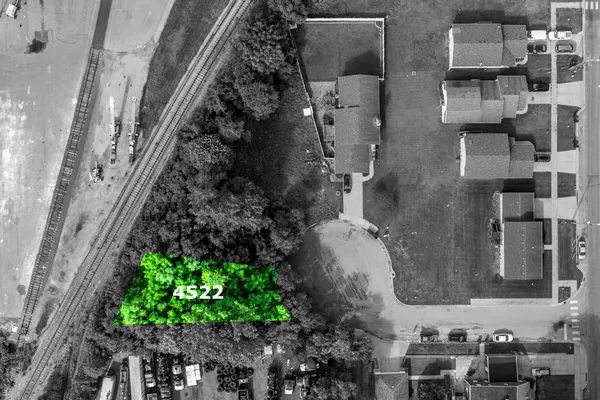 a aerial view of a residential apartment building with a yard