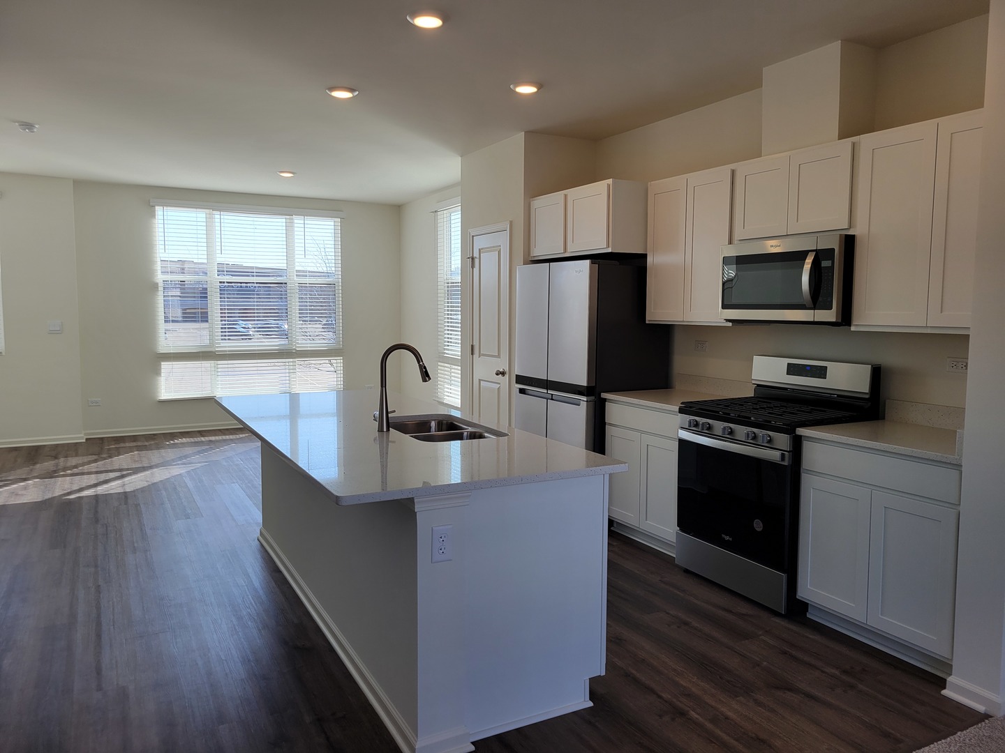 331 Summit Circle Lombard, IL 60148 - Photo 7 of 47 a kitchen with stainless steel appliances a sink dishwasher a refrigerator and a stove with wooden floor