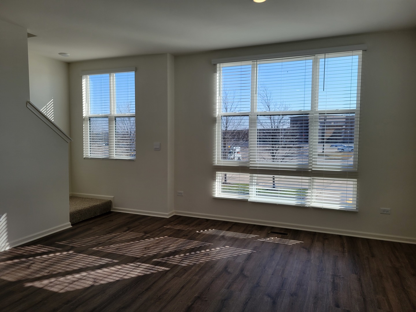 331 Summit Circle Lombard, IL 60148 - Photo 9 of 47 a view of an empty room with wooden floor and a window
