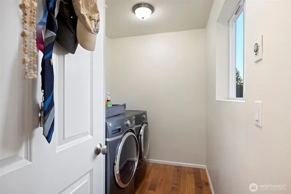 a bedroom with furniture and a large window