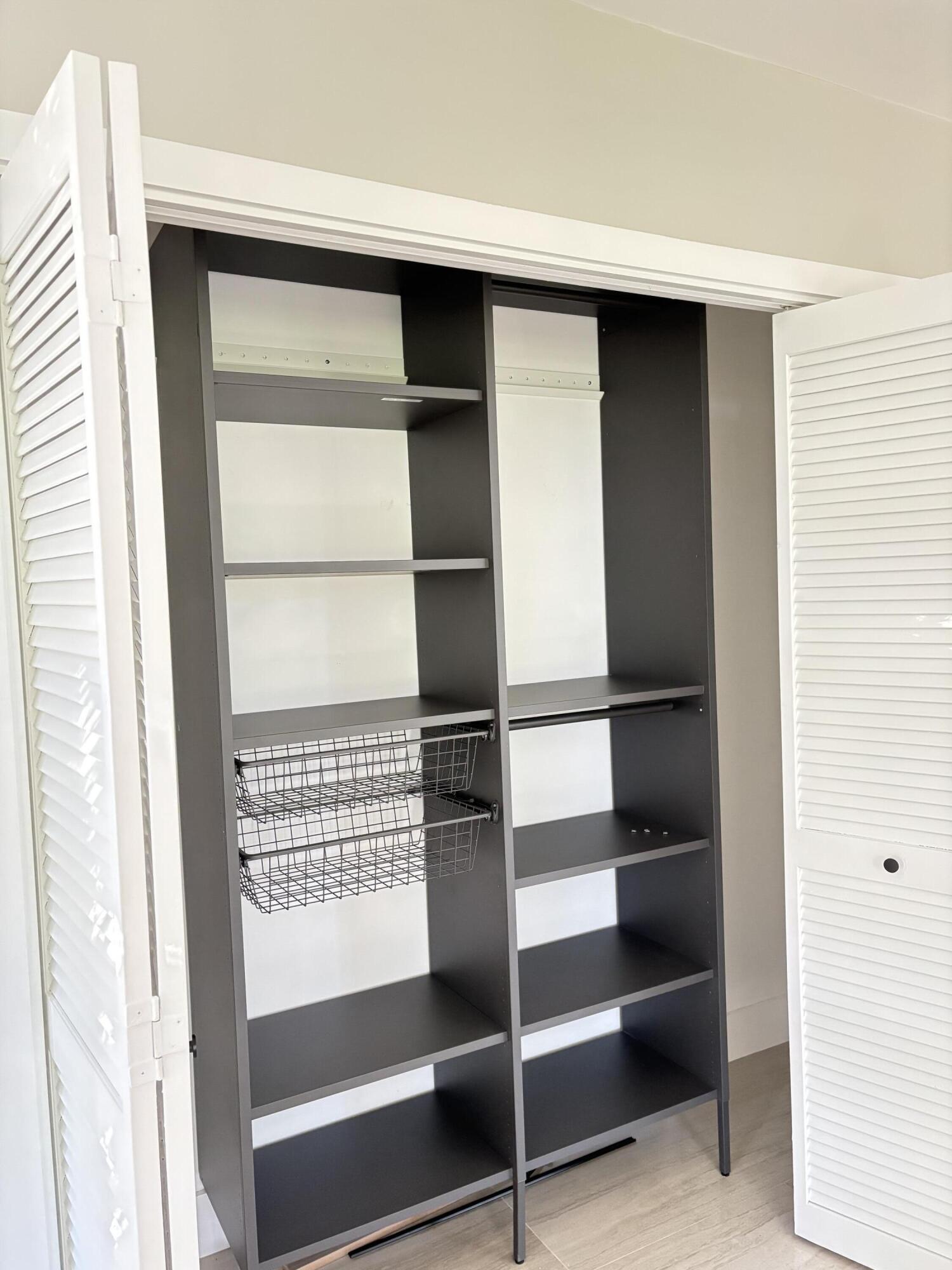 545 Oaks Lane, Unit 201 Pompano Beach, FL 33069 - Photo 11 of 22 a view of walk in closet with empty racks