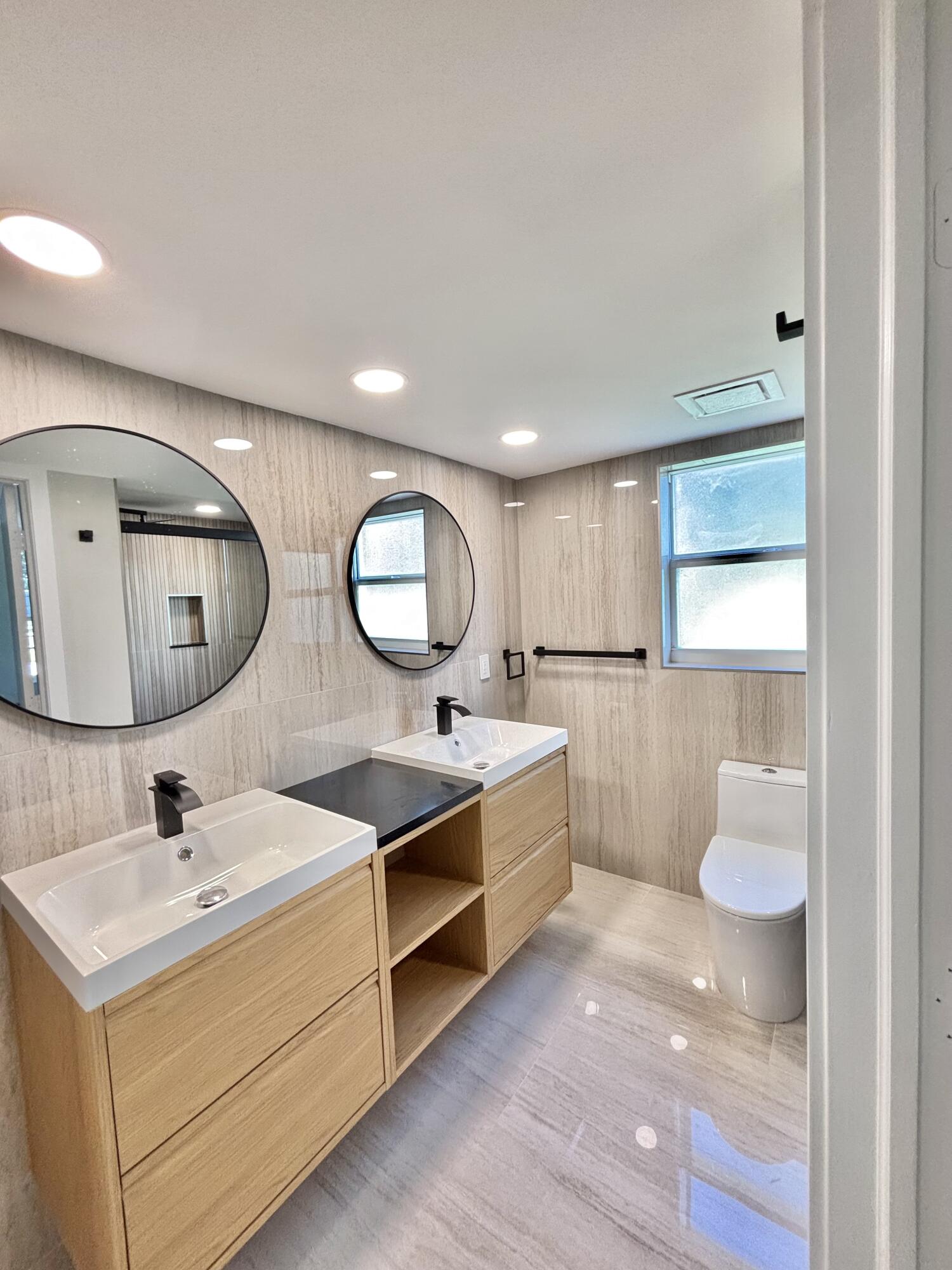 545 Oaks Lane, Unit 201 Pompano Beach, FL 33069 - Photo 12 of 22 a kitchen with a sink and a stove