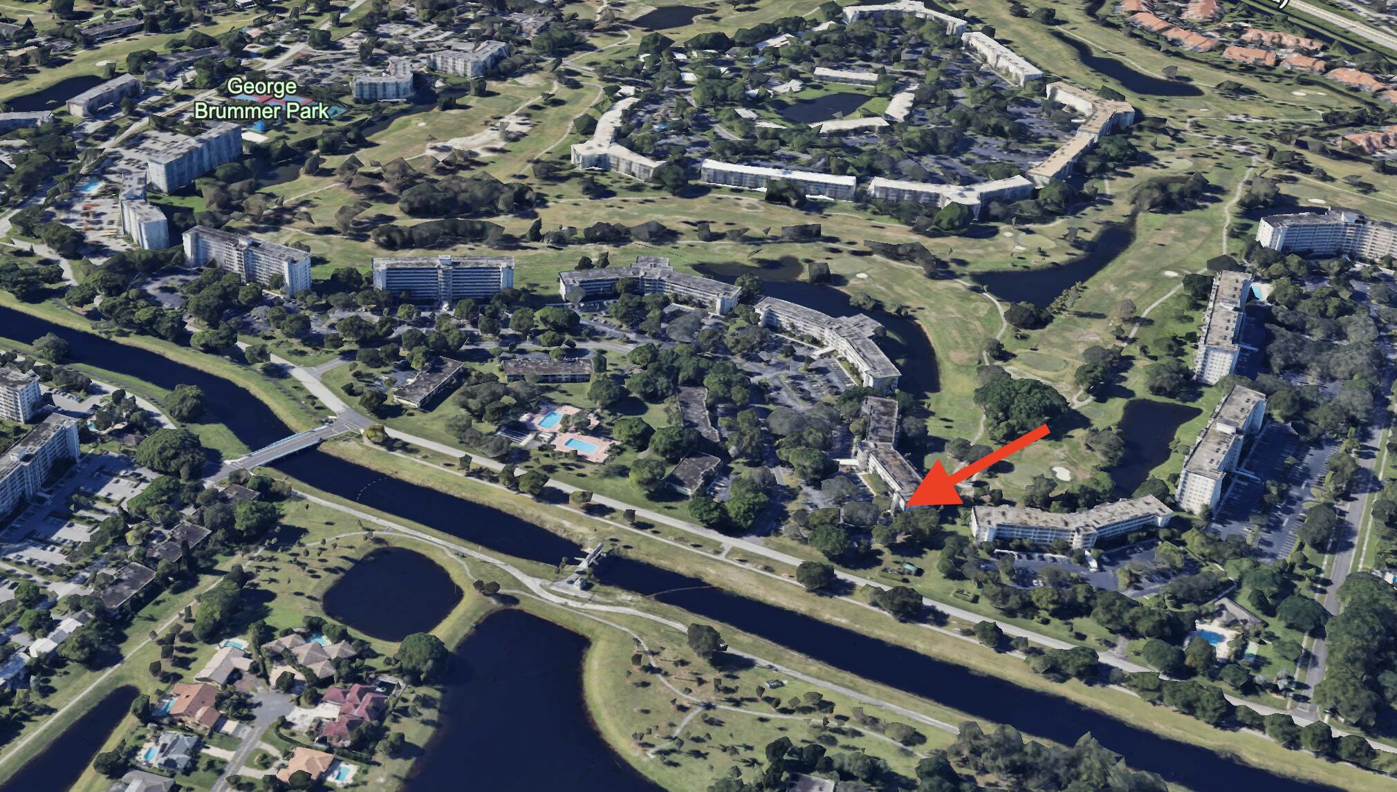 545 Oaks Lane, Unit 201 Pompano Beach, FL 33069 - Photo 20 of 22 an outdoor space with wooden floor