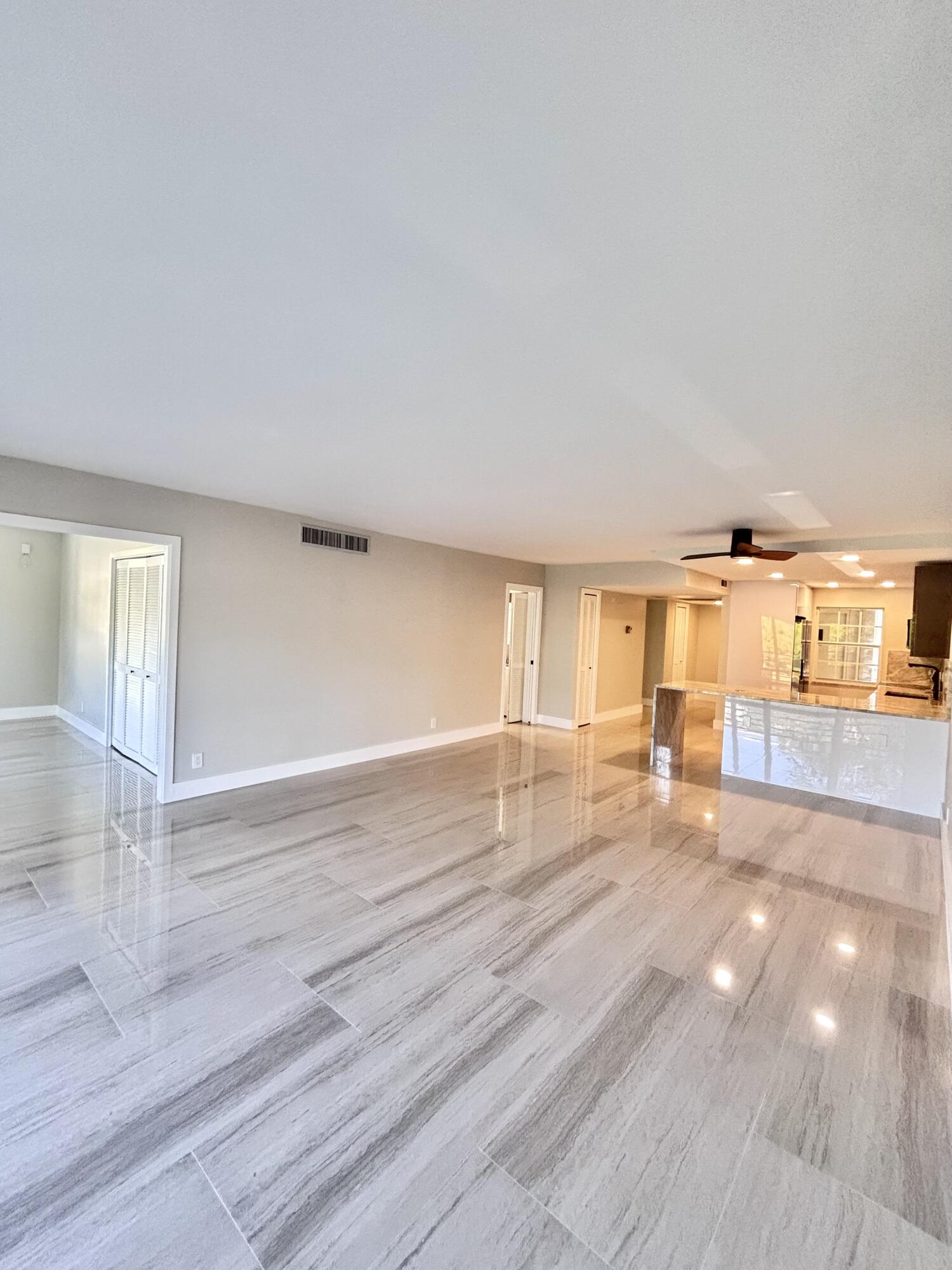 545 Oaks Lane, Unit 201 Pompano Beach, FL 33069 - Photo 7 of 22 a view of a livingroom with wooden floor