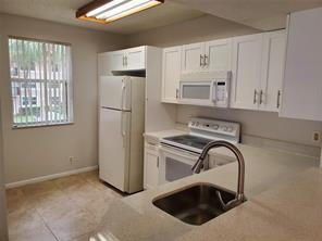 8871 Wiles Road, Unit 207 Coral Springs, FL 33067 - Photo 5 of 12 8871 #207 KITCHEN