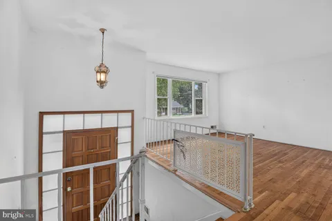 a view of a hallway with windows