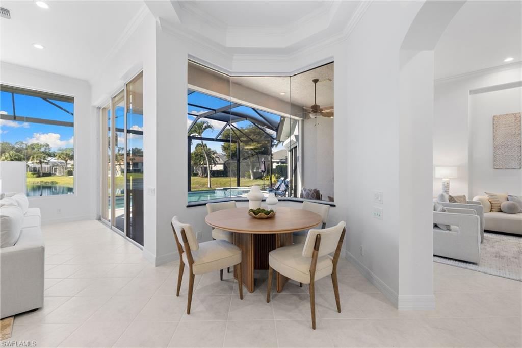 1624 Manchester Court Naples, FL 34109 - Photo 16 of 49 Dining room with a sunroom, ornamental molding, ceiling fan, recessed lighting, and light tile patterned flooring