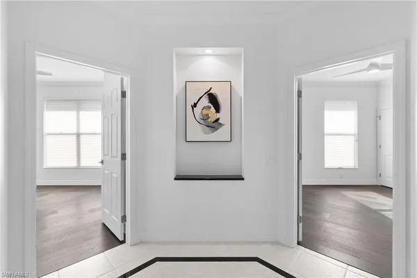 a view of an entryway with wooden floor