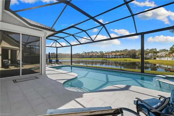 a view of a swimming pool with a patio