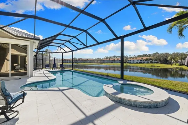 a view of a swimming pool with a patio