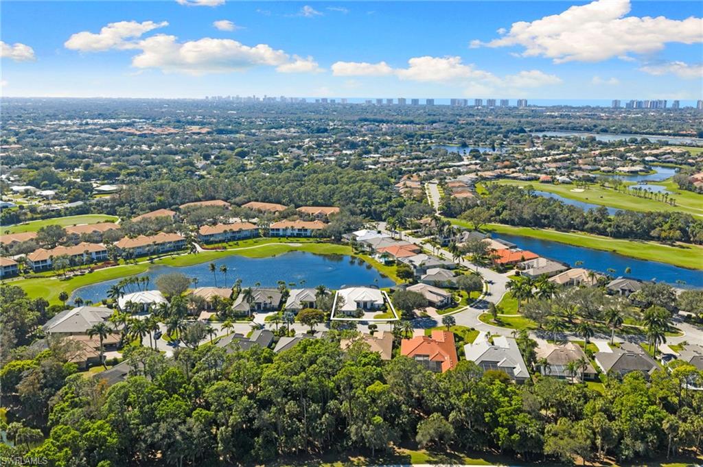 1624 Manchester Court Naples, FL 34109 - Photo 47 of 49 Aerial perspective of suburban area featuring a nearby body of water and a golf course
