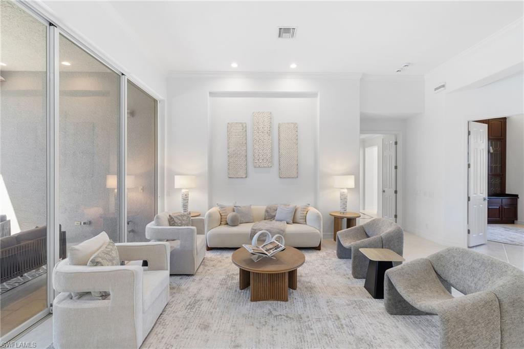 1624 Manchester Court Naples, FL 34109 - Photo 9 of 49 Living room featuring recessed lighting, ornamental molding, and light tile patterned floors