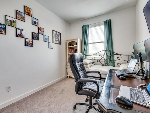 a workspace with furniture and a window