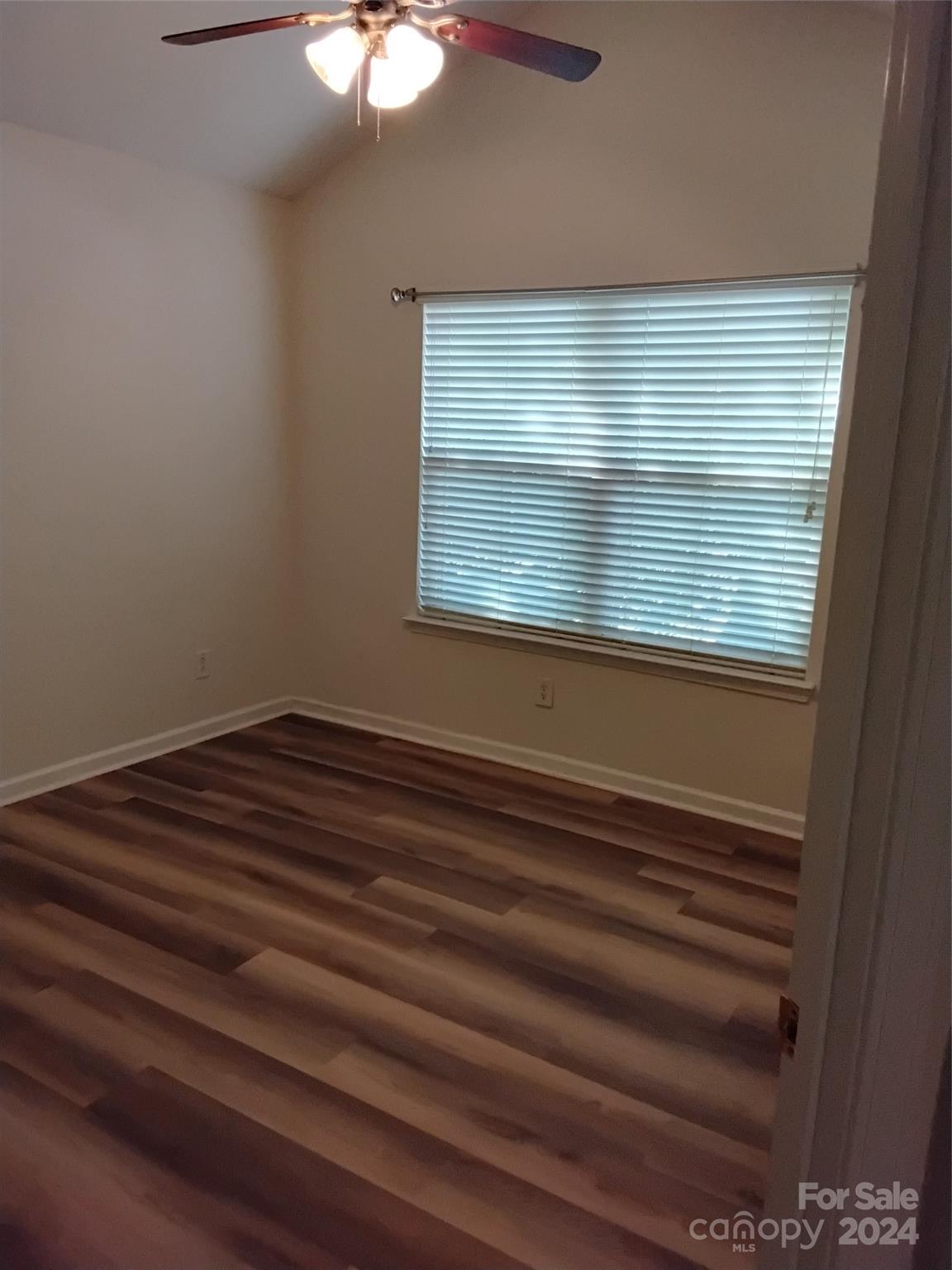 817 Ledgestone Court Fort Mill, SC 29708 - Photo 16 of 36 a view of a room with wooden floor and a window