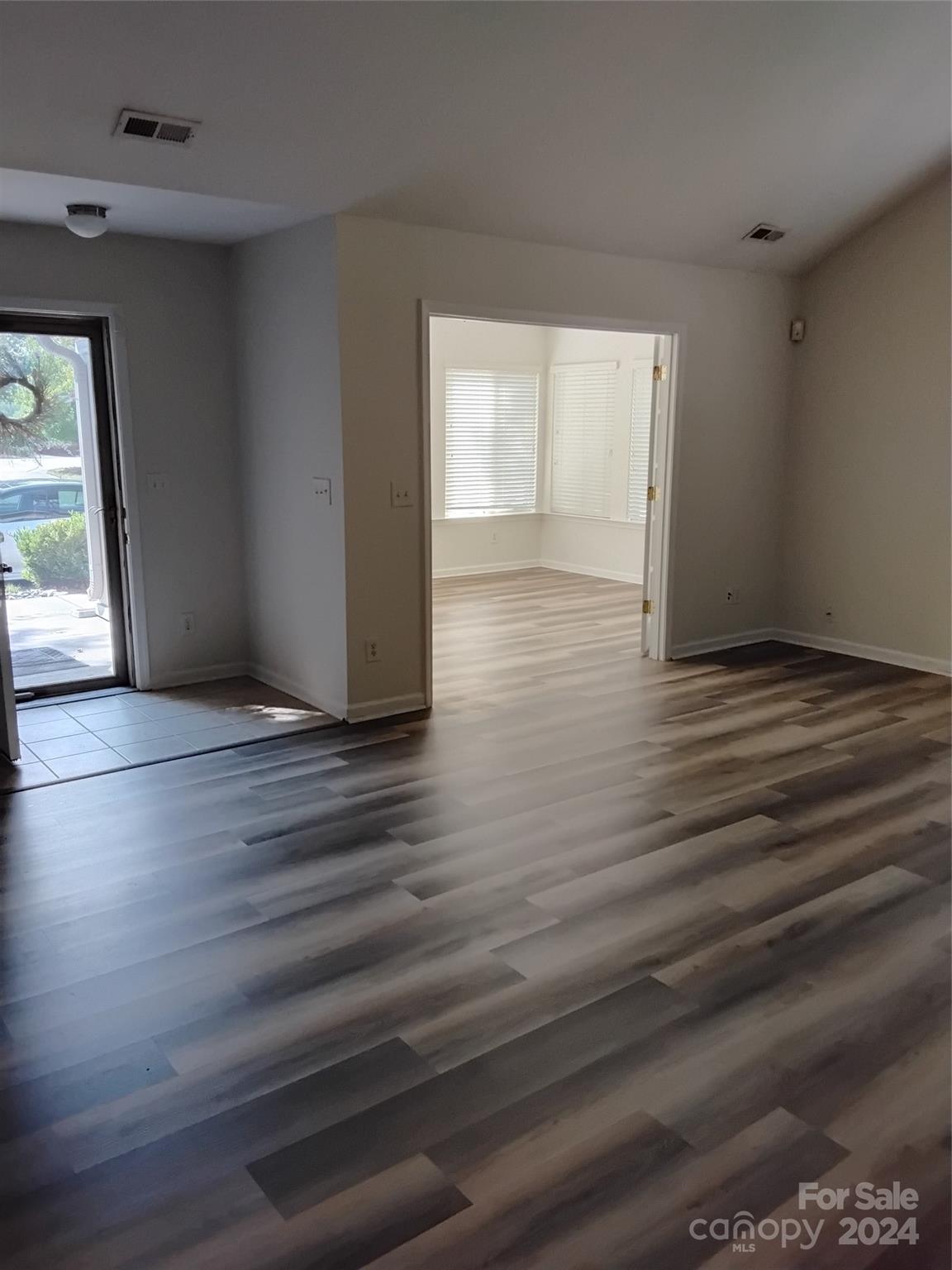817 Ledgestone Court Fort Mill, SC 29708 - Photo 23 of 36 wooden floor in an empty room with a window