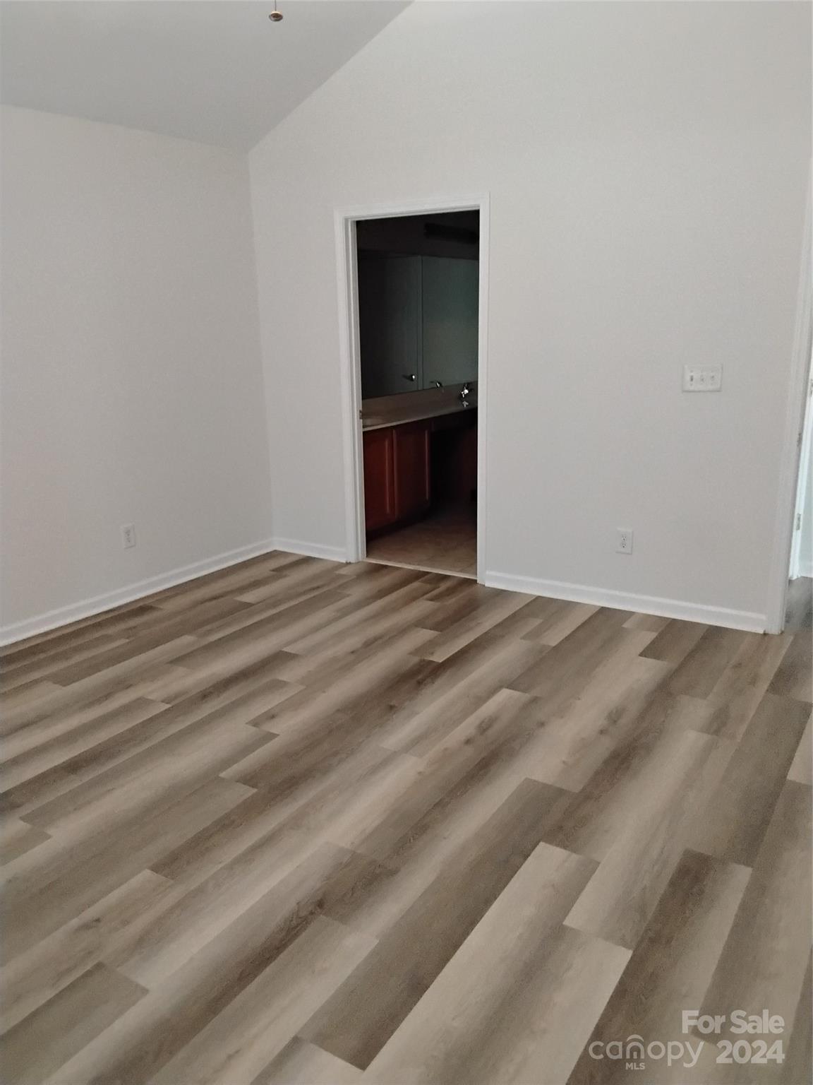 817 Ledgestone Court Fort Mill, SC 29708 - Photo 25 of 36 a view of an empty room with wooden floor