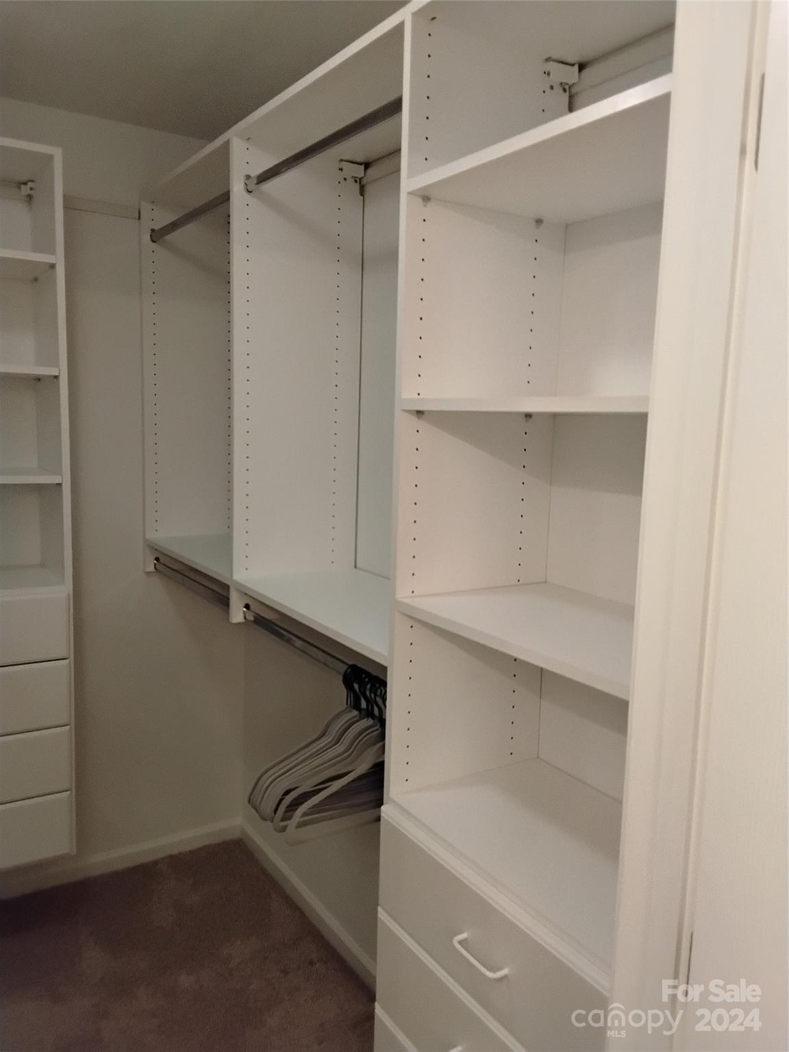 817 Ledgestone Court Fort Mill, SC 29708 - Photo 28 of 36 a close view of an empty walk in closet