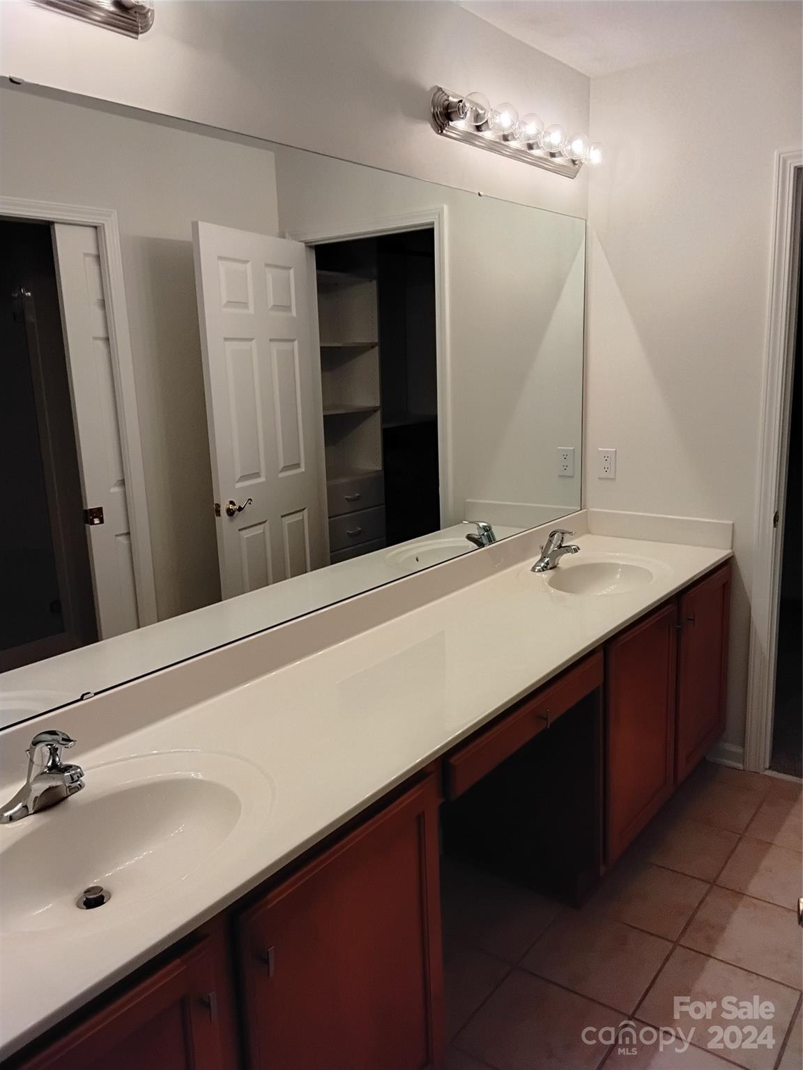 817 Ledgestone Court Fort Mill, SC 29708 - Photo 33 of 36 a bathroom with a double vanity sink a and mirror