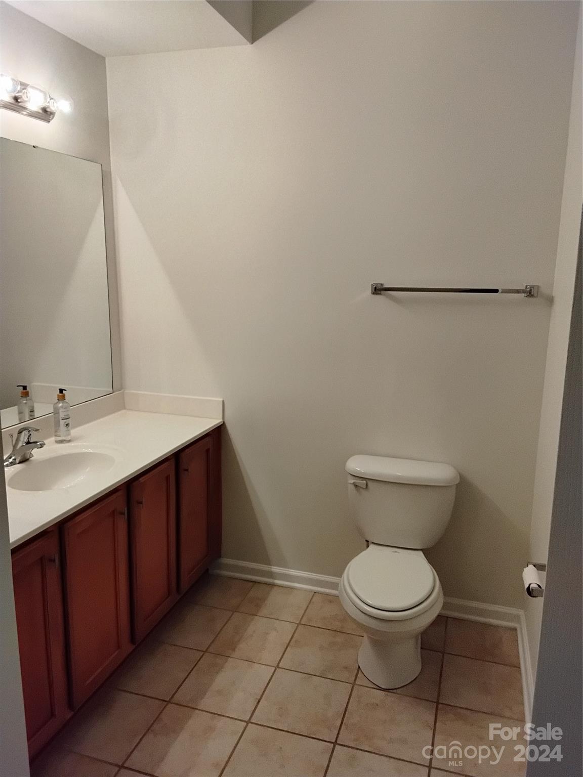 817 Ledgestone Court Fort Mill, SC 29708 - Photo 34 of 36 a bathroom with a toilet sink and mirror