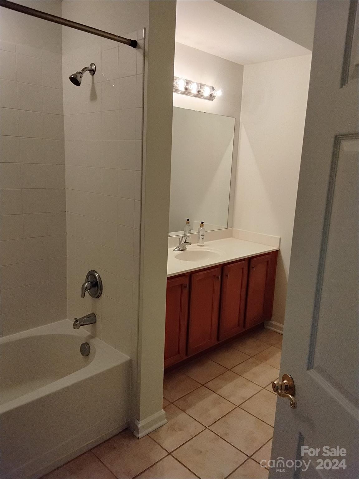 817 Ledgestone Court Fort Mill, SC 29708 - Photo 35 of 36 a bathroom with a tub a sink and a mirror
