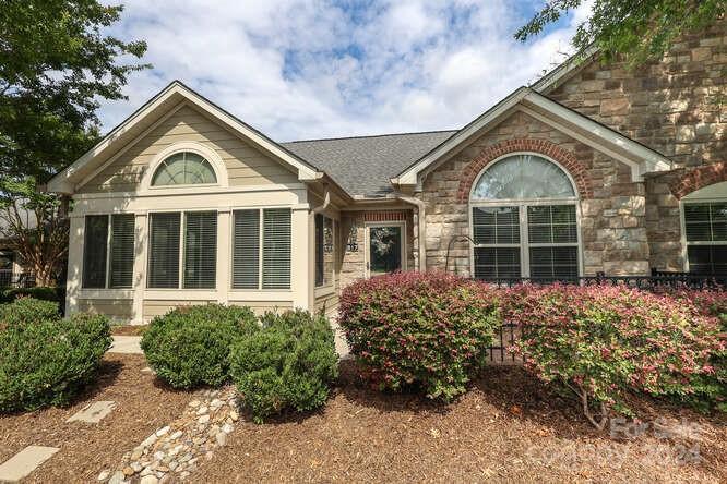 817 Ledgestone Court Fort Mill, SC 29708 - Photo 5 of 36 front view of a house with a garden