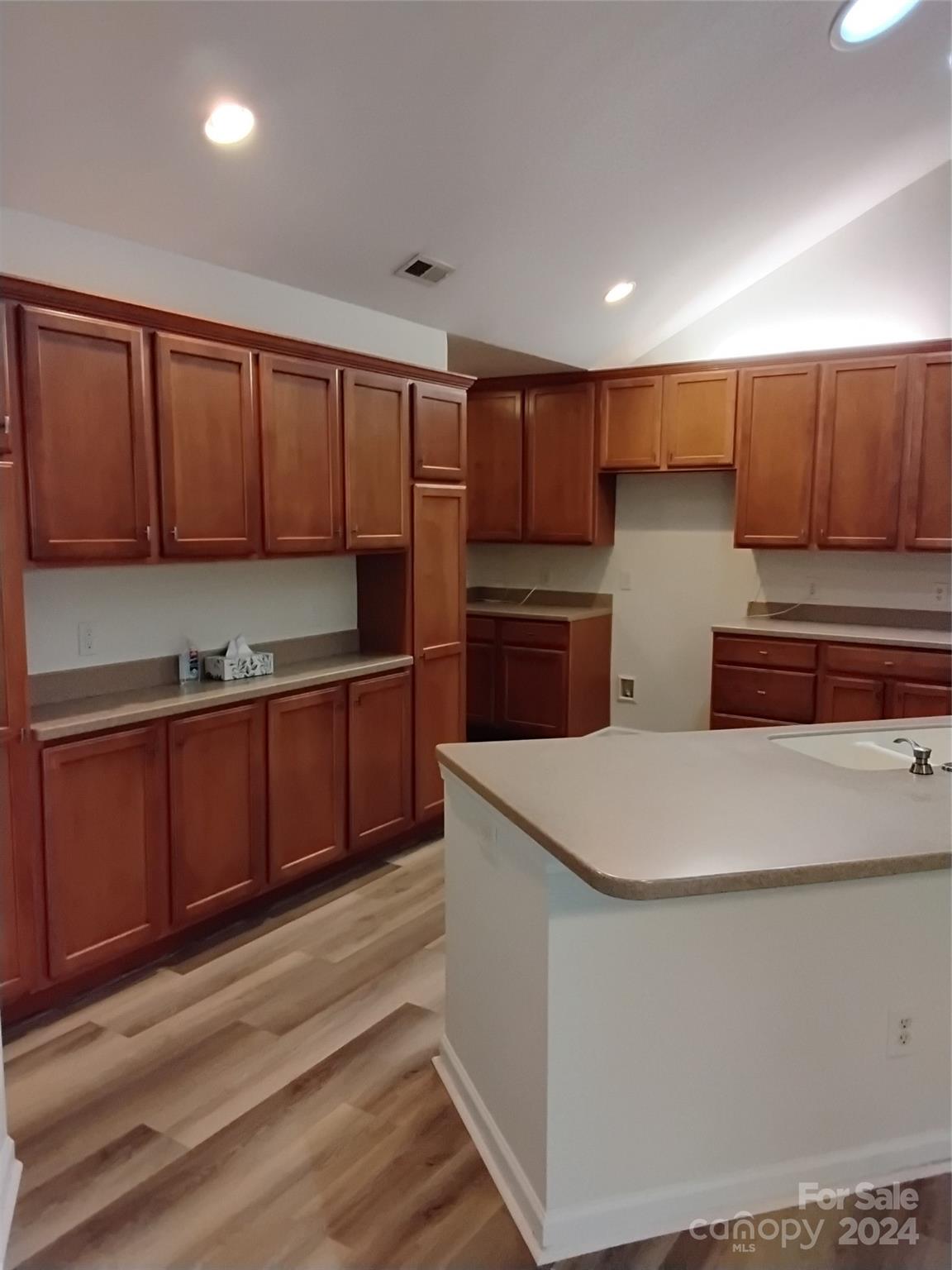 817 Ledgestone Court Fort Mill, SC 29708 - Photo 8 of 36 a kitchen with stainless steel appliances a refrigerator sink and cabinets