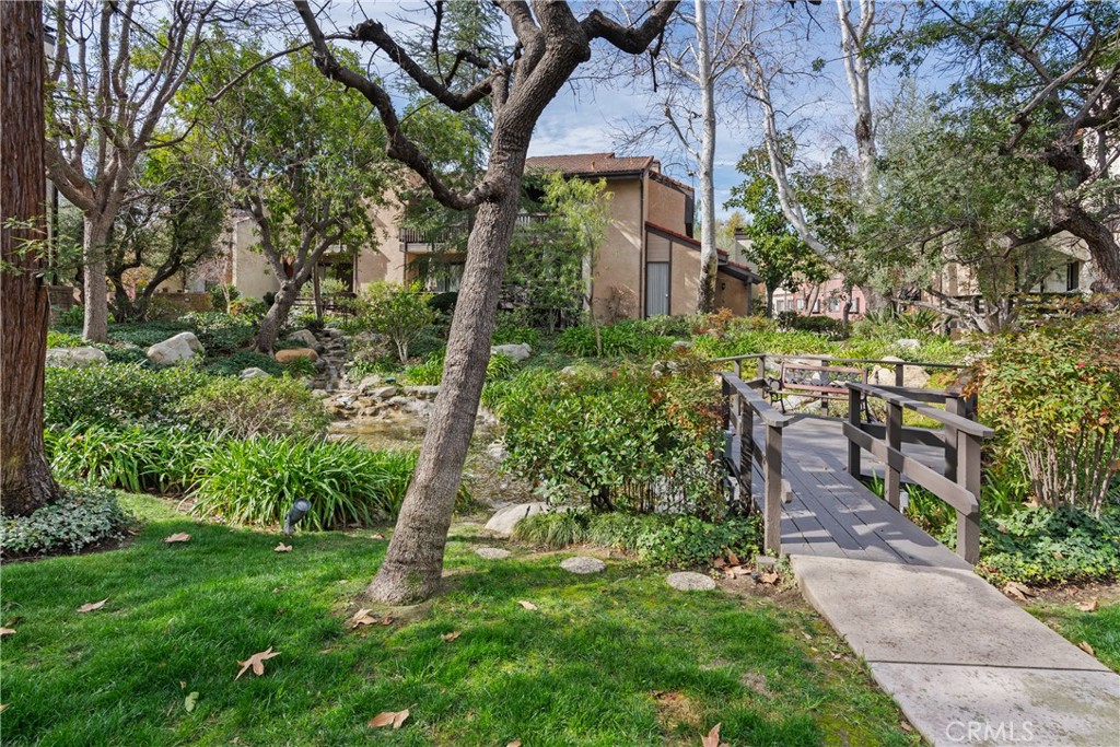5757 Owensmouth Avenue, Unit 1 Woodland Hills, CA 91367 - Photo 2 of 42 a backyard of a house with lots of green space